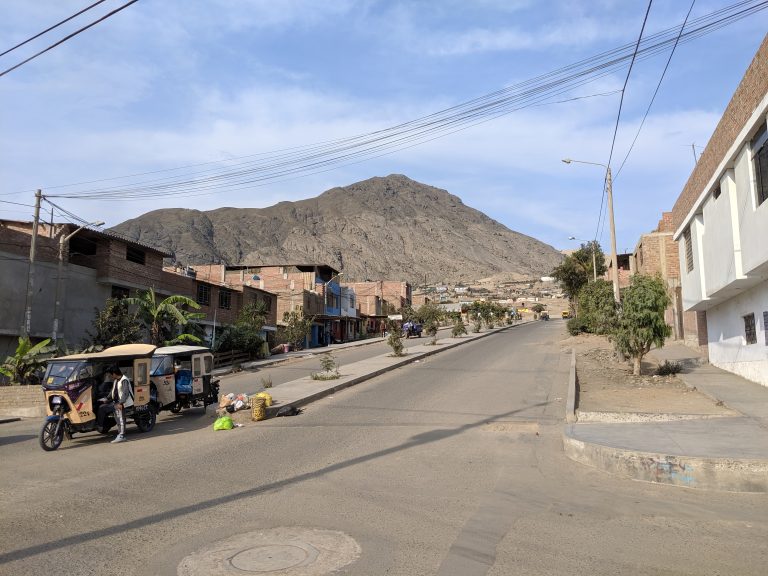 Typical street in La Esperanza with a view of Cerro Cabras mountain.